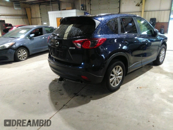 2016 Mazda CX-5 Sport with VIN JM3KE2BY5G0782385, listed as a IAAI auction lot 41971163 with 87,251 mi miles. Bid and sale history available at carsss.com. Image 4.