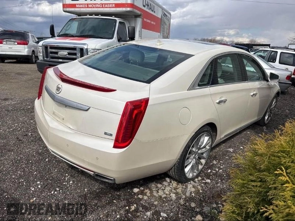 2013 Cadillac XTS Platinum z VIN 2G61V5S33D9173441, wystawiony jako IAAI lot #41902672 z przebiegiem 103 044 mil mil oraz . Historia ofert i sprzedaży dostępna na DreamBid. Obrazek 4.