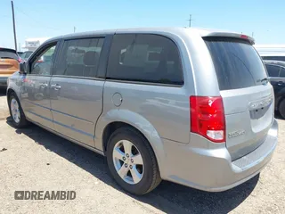 2013 Dodge Grand Caravan SE with VIN 2C4RDGBG0DR702913, listed as a IAAI auction lot 42007786 with 163,981 mi miles and . Bid and sale history available at DreamBid. Image 3.