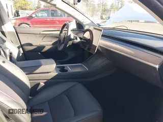 2023 Tesla Model Y Performance with VIN 7SAYGDEF3PF711497, listed as a IAAI auction lot 41877450 with 21,887 mi miles and . Bid and sale history available at DreamBid. Image 5.