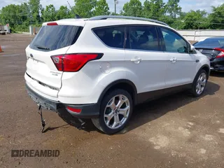2019 Ford Escape Titanium with VIN 1FMCU9J98KUA95238, listed as a IAAI auction lot 42525324 with 59,222 mi miles and . Bid and sale history available at DreamBid. Image 4.