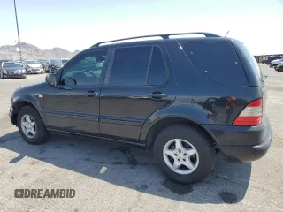 2001 Mercedes-Benz M 320/430/500 with VIN 4JGAB54EX1A241105, listed as a Copart auction lot 59773455 with 242,944 mi miles and Salvage title. Bid and sale history available at DreamBid. Image 2.