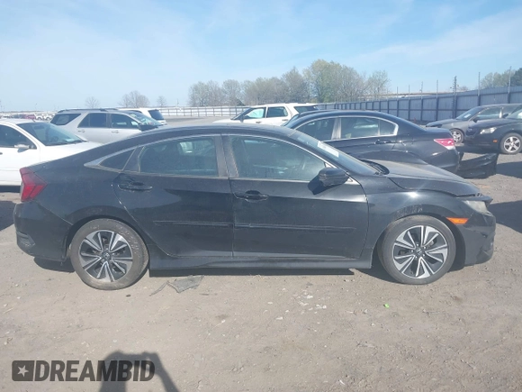 2016 Honda Civic EX-T z VIN 2HGFC1F3XGH630558, wystawiony jako IAAI lot #41868334 z przebiegiem 154 452 mil mil oraz . Historia ofert i sprzedaży dostępna na DreamBid. Obrazek 13.