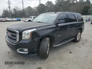 2015 GMC Yukon SLT with VIN 1GKS1BKC1FR615562, listed as a Copart auction lot 46374135 with 141,207 mi miles and Salvage Title. Bid and sale history available at carsss.com. Image 1.