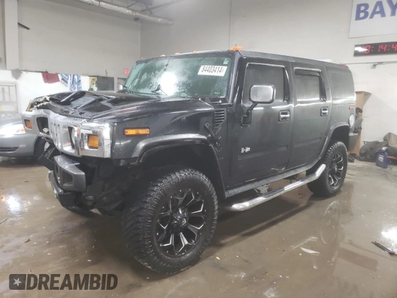 2003 Hummer H2 with VIN 5GRGN23U33H143023, listed as a Copart auction lot 84403414 with 0 mi miles and Salvage Title. Bid and sale history available at carsss.com. Image 1.