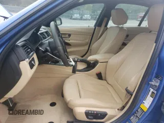2015 BMW 3 Series 328i xDrive with VIN WBA3B5G50FNS12329, listed as a Copart auction lot 62928215 with 146,562 mi miles and Salvage title. Bid and sale history available at DreamBid. Image 7.