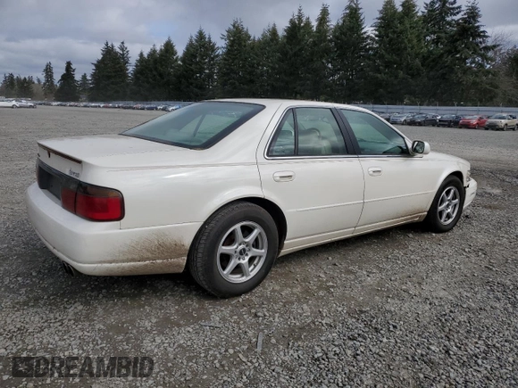 2000 Cadillac Seville Touring STS z VIN 1G6KY5497YU191639, wystawiony jako Copart lot #49658115 z przebiegiem 82 725 mil mil oraz Szkoda całkowita • Salvage title. Historia ofert i sprzedaży dostępna na DreamBid. Obrazek 3.