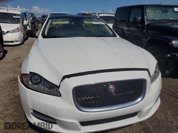 2014 Jaguar XJ Portfolio z VIN SAJWA2GZ0E8V59422, wystawiony jako Copart lot #74213414 z przebiegiem 96 314 mil mil oraz Nie do naprawy • Non repairable. Historia ofert i sprzedaży dostępna na DreamBid. Obrazek 5.