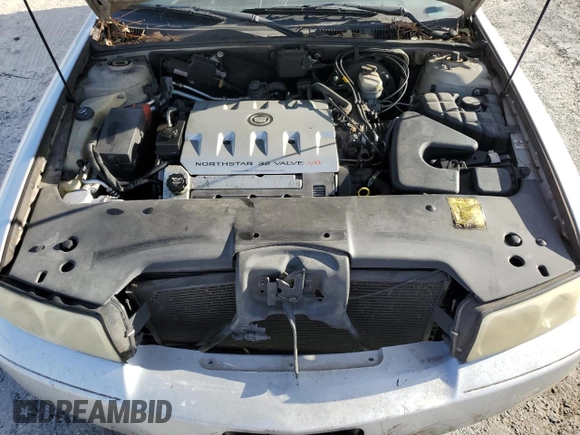2003 Cadillac Seville Touring STS z VIN 1G6KY54923U101998, wystawiony jako Copart lot #74029304 z przebiegiem 134 157 mil mil oraz Szkoda całkowita • Salvage title. Historia ofert i sprzedaży dostępna na DreamBid. Obrazek 13.