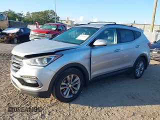 2018 Hyundai Santa Fe 2.0T z VIN 5XYZU4LA1JG516466, wystawiony jako IAAI lot #42265607 z przebiegiem 110 655 mil mil oraz . Historia ofert i sprzedaży dostępna na DreamBid. Obrazek 2.