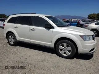 2013 Dodge Journey American Value with VIN 3C4PDCAB2DT547459, listed as a Copart auction lot 61217605 with 116,740 mi miles and Clean title. Bid and sale history available at DreamBid. Image 4.