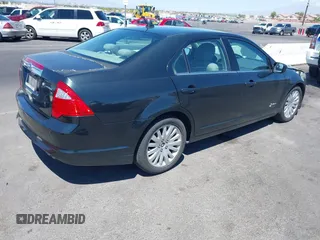 2010 Ford Fusion Hybrid with VIN 3FADP0L36AR355961, listed as a IAAI auction lot 42217637 with 256,817 mi miles and . Bid and sale history available at DreamBid. Image 4.