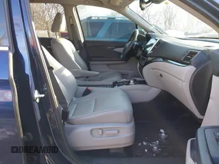 2017 Honda Pilot Touring with VIN 5FNYF6H99HB105446, listed as a IAAI auction lot 41283368 with 91,452 mi miles and . Bid and sale history available at DreamBid. Image 5.