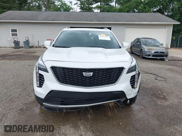 2022 Cadillac XT4 AWD Premium Luxury z VIN 1GYFZDR42NF128199, wystawiony jako IAAI lot #42522314 z przebiegiem 29 002 mil mil oraz . Historia ofert i sprzedaży dostępna na DreamBid. Obrazek 12.