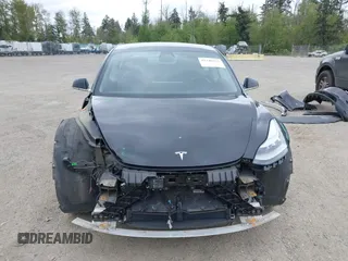 2019 Tesla Model 3 Mid Range with VIN 5YJ3E1EA6KF415656, listed as a IAAI auction lot 42140763 with 71,408 mi miles and . Bid and sale history available at carsss.com. Image 13.