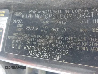 2007 Kia Rondo LX with VIN KNAFG525877075202, listed as a IAAI auction lot 42014611 with 206,496 mi miles. Bid and sale history available at carsss.com. Image 9.