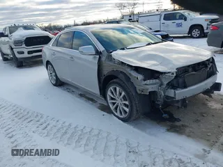 2015 Cadillac XTS Luxury z VIN 2G61M5S39F9229744, wystawiony jako IAAI lot #41353817 z przebiegiem 117 427 mil mil oraz . Historia ofert i sprzedaży dostępna na DreamBid. Obrazek 1.