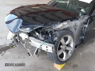 2008 Nissan 350Z z VIN JN1BZ34D98M705867, wystawiony jako IAAI lot #41871586 z przebiegiem 90 717 mil mil oraz . Historia ofert i sprzedaży dostępna na DreamBid. Obrazek 6.