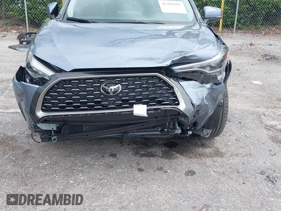 2023 Toyota Corolla Cross XLE with VIN 7MUDAAAGXPV070263, listed as a IAAI auction lot 42394307 with 18,977 mi miles and . Bid and sale history available at DreamBid. Image 6.