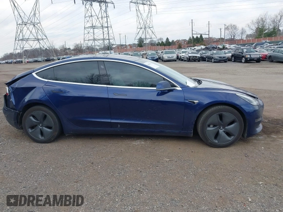 2018 Tesla Model 3 Long Range Battery with VIN 5YJ3E1EB2JF056166, listed as a IAAI auction lot 41847972 with 126,126 mi miles and . Bid and sale history available at DreamBid. Image 14.