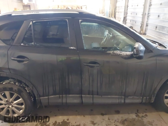 2015 Mazda CX-5 Touring with VIN JM3KE2CY2F0458114, listed as a IAAI auction lot 41545493 with 138,061 mi miles. Bid and sale history available at carsss.com. Image 14.