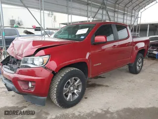 2015 Chevrolet Colorado 4WD Z71 with VIN 1GCGTCE38F1165453, listed as a IAAI auction lot 41548031 with 147,742 mi miles. Bid and sale history available at carsss.com. Image 2.