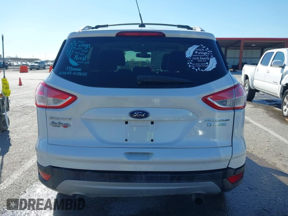2013 Ford Escape Titanium with VIN 1FMCU0J96DUA71857, listed as a IAAI auction lot 41877003 with 118,864 mi miles and . Bid and sale history available at carsss.com. Image 16.