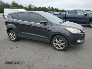 2013 Ford Escape SEL with VIN 1FMCU9H92DUA86916, listed as a Copart auction lot 63516415 with 167,791 mi miles and Salvage title. Bid and sale history available at DreamBid. Image 4.