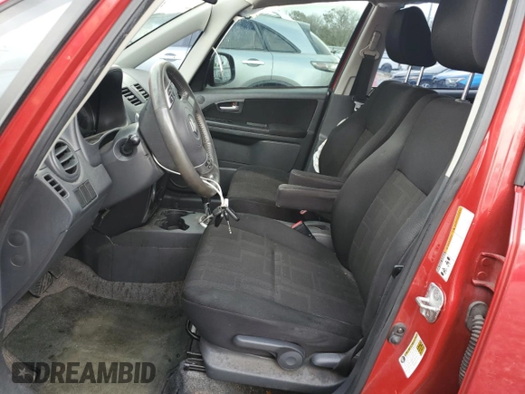2012 Suzuki SX4 LE with VIN JS2YC5A39C6300577, listed as a Copart auction lot 86998944 with 103,354 mi miles and Non Repairable. Bid and sale history available at carsss.com. Image 7.