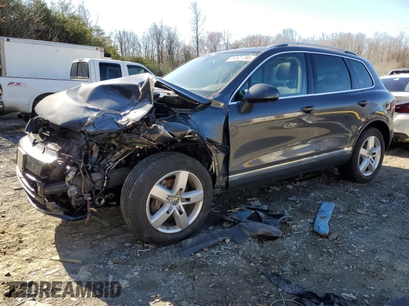 2012 Volkswagen Touareg Lux с VIN WVGEK9BP1CD008132, выставлен на аукционе Copart как лот 49501765 с пробегом 156 594 миль миль и Списание • Salvage title. История ставок и продаж доступна на DreamBid. Изображение 1.