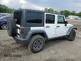 2014 Jeep Wrangler Unlimited Rubicon with VIN 1C4HJWFG4EL114743, listed as a Copart auction lot 61397575 with 110,222 mi miles and Salvage title. Bid and sale history available at DreamBid. Image 3.