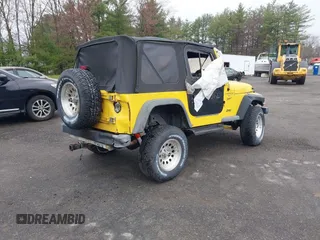 2000 Jeep Wrangler Sport with VIN 1J4FA49S9YP736984, listed as a IAAI auction lot 42055385 with 191,910 mi miles and . Bid and sale history available at DreamBid. Image 4.
