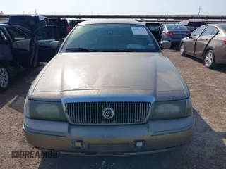 2004 Mercury Grand Marquis GS z VIN 2MEFM74WX4X643435, wystawiony jako IAAI lot #41932119 z przebiegiem 274 468 mil mil oraz . Historia ofert i sprzedaży dostępna na DreamBid. Obrazek 6.