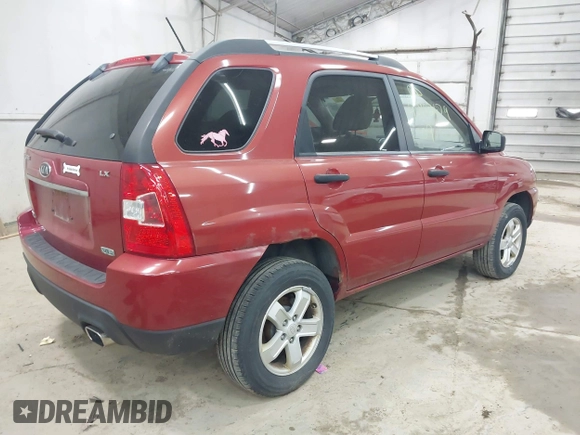 2009 Kia Sportage LX with VIN KNDJE723497555026, listed as a IAAI auction lot 42102679 with 136,398 mi miles. Bid and sale history available at carsss.com. Image 4.