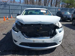 2015 Ford Taurus SE with VIN 1FAHP2D80FG176157, listed as a IAAI auction lot 41985771 with 102,252 mi miles and . Bid and sale history available at carsss.com. Image 6.