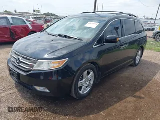 2013 Honda Odyssey Touring with VIN 5FNRL5H95DB086041, listed as a IAAI auction lot 42477974 with 213,343 mi miles and . Bid and sale history available at DreamBid. Image 2.