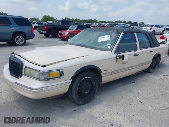 1997 Lincoln Town Car Cartier with VIN 1LNLM83W8VY627663, listed as a IAAI auction lot 42392454 with 209,440 mi miles and . Bid and sale history available at DreamBid. Image 2.