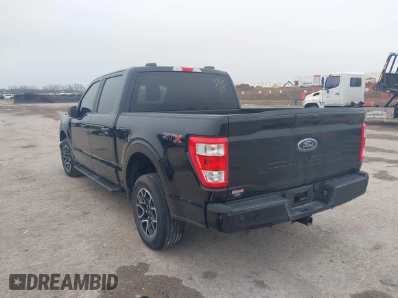 2023 Ford F-150 XL with VIN 1FTEW1C55PKD01184, listed as a IAAI auction lot 41700658 with 18,804 mi miles. Bid and sale history available at carsss.com. Image 3.