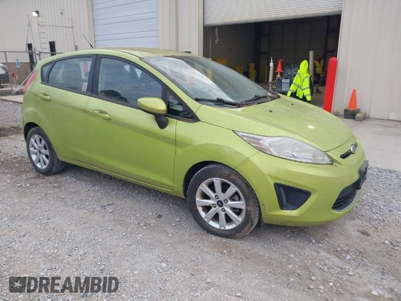 2011 Ford Fiesta SE with VIN 3FADP4EJXBM164397, listed as a IAAI auction lot 42046591 with 118,953 mi miles. Bid and sale history available at carsss.com. Image 1.