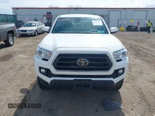 2023 Toyota Tacoma SR with VIN 3TMCZ5AN2PM642205, listed as a IAAI auction lot 42167945 with 10,595 mi miles and . Bid and sale history available at DreamBid. Image 13.