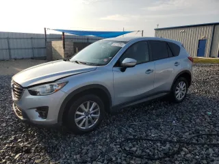 2016 Mazda CX-5 Touring z VIN JM3KE2CYXG0882531, wystawiony jako Copart lot #57713545 z przebiegiem 97 572 mil mil oraz Szkoda całkowita • Salvage title. Historia ofert i sprzedaży dostępna na DreamBid. Obrazek 1.