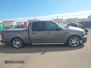 2002 Ford F-150 Harley Davidson with VIN 1FTRW07312KC88379, listed as a IAAI auction lot 41657219 with 1 mi miles. Bid and sale history available at carsss.com. Image 13.