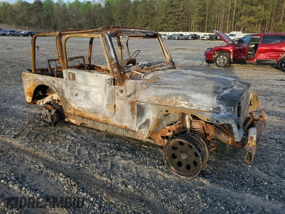 2004 Jeep Wrangler Rubicon with VIN 1J4FA69S54P710341, listed as a Copart auction lot 51749175 with Not provided miles and Non repairable. Bid and sale history available at DreamBid. Image 4.