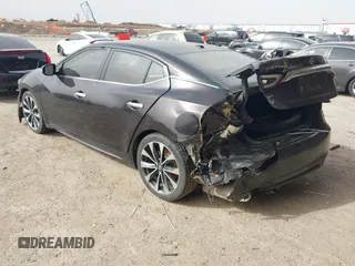 2016 Nissan Maxima SL z VIN 1N4AA6AP1GC379279, wystawiony jako IAAI lot #41738089 z przebiegiem 113 677 mil mil oraz . Historia ofert i sprzedaży dostępna na DreamBid. Obrazek 3.