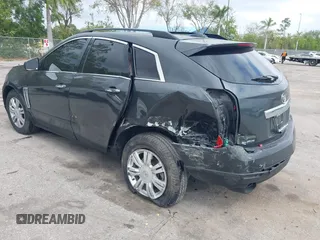 2015 Cadillac SRX with VIN 3GYFNAE30FS569009, listed as a IAAI auction lot 41718522 with 104,448 mi miles and . Bid and sale history available at DreamBid. Image 3.