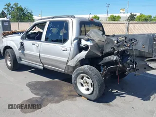 2005 Ford Explorer Sport Trac XLS z VIN 1FMDU67K25UA01209, wystawiony jako IAAI lot #39448448 z przebiegiem Nie podano mil oraz . Historia ofert i sprzedaży dostępna na DreamBid. Obrazek 3.
