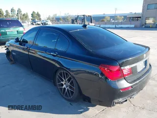 2014 BMW 7 Series 740Li with VIN WBAYE4C56ED137847, listed as a IAAI auction lot 39452255 with 184,471 mi miles. Bid and sale history available at carsss.com. Image 3.