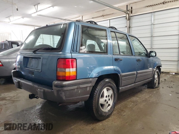 1994 Jeep Grand Cherokee Laredo with VIN 1J4FX58S0RC316030, listed as a Copart auction lot 66178754 with 281,785 mi miles and Salvage Title. Bid and sale history available at carsss.com. Image 3.