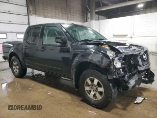 2010 Nissan Frontier LE with VIN 1N6AD0EV6AC412658, listed as a Copart auction lot 42023495 with 95,141 mi miles and Salvage title. Bid and sale history available at DreamBid. Image 4.