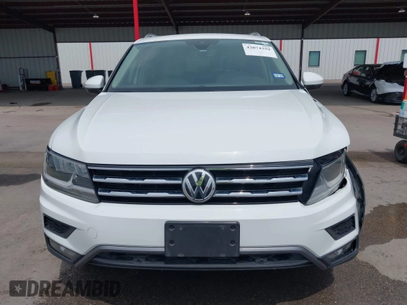 2020 Volkswagen Tiguan SE z VIN 3VV3B7AX4LM032609, wystawiony jako IAAI lot #42074359 z przebiegiem 52 404 mil mil oraz . Historia ofert i sprzedaży dostępna na DreamBid. Obrazek 12.